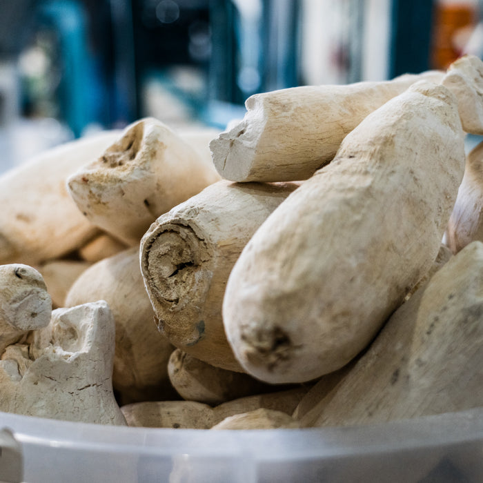 Washed, dried and peeled cassava roots