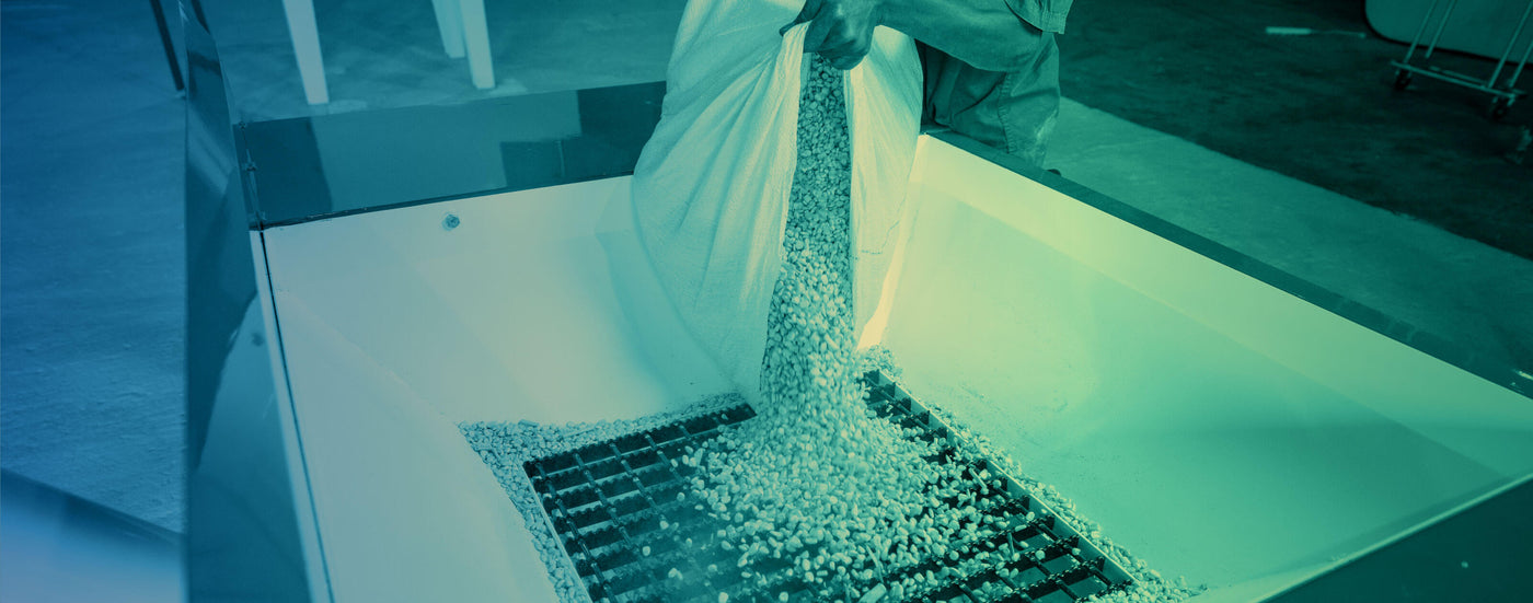 Pouring maize from a bag for milling in the SP-1