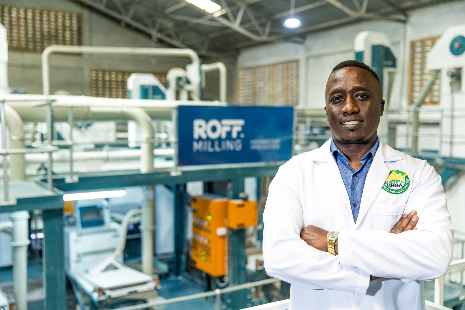 Evans Killy, Owner of Buffalo Millers in Eldoret, Kenya standing in front of his new Roff R-70 Maize Mill