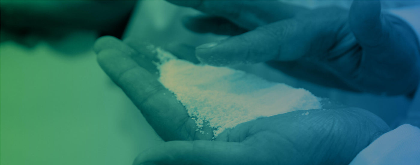 Hands handling maize meal