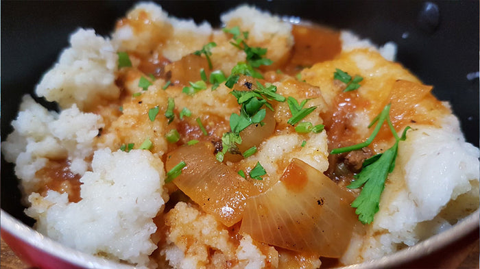 Plate of maize porridge and gravy